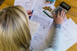 Overhead View of Woman Analyzing Expences — Overland Park, KS — Wiesner & Frackowiak LC