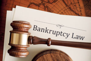 Gavel and bankruptcy law documents, from the firm of a Kansas City bankruptcy attorney, Wiesner & Frackowiak LC.